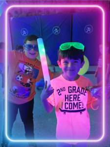 boys smiling with LED lights